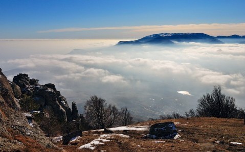 Another view from the top of mountains with low clouds
